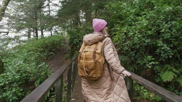 Camera Follows Woman on Trip Traveler Walking in Beautiful Mountain Rainforest