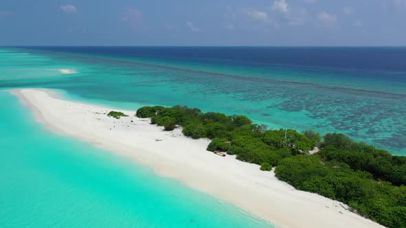 Aerial panorama of tropical coastline beach holiday by turquoise lagoon with white sand background o