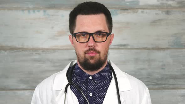 Bearded Man Doctor in Glasses with Stethoscope