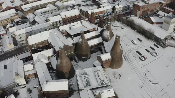 Aerial view of the famous bottle kilns at Gladstone Pottery Museum, covered in snow on a cold winter