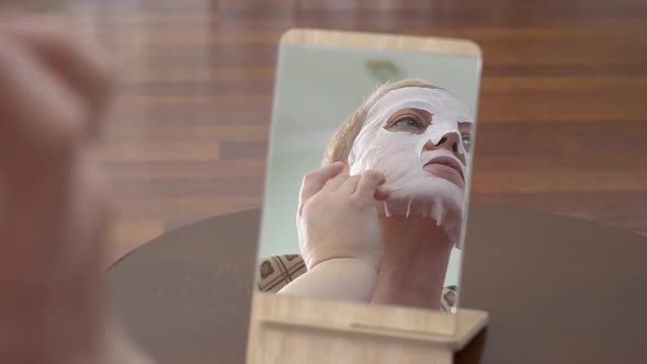 Mature Woman in Facial Mask for Face