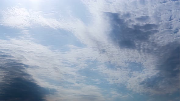 Clouds Flying Blue Sky with a Bright Sun