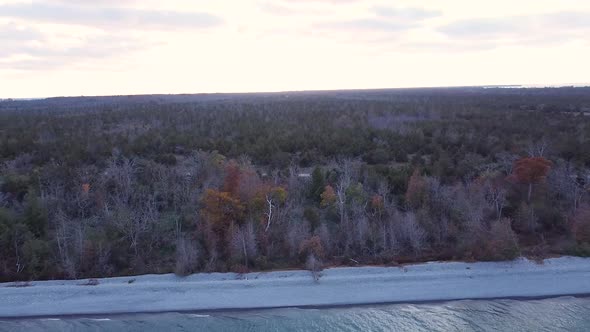 Aerial over a lake pushing towards coast line day time