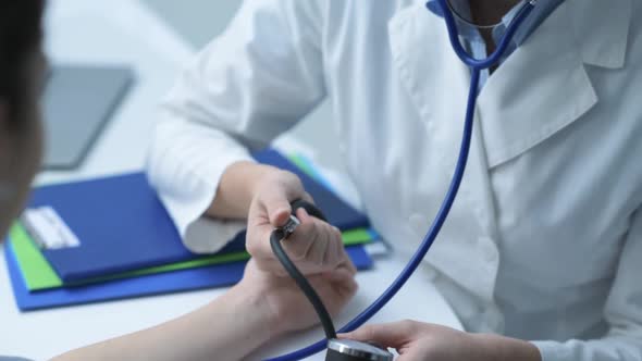 Doctor measuring a patient's blood pressure