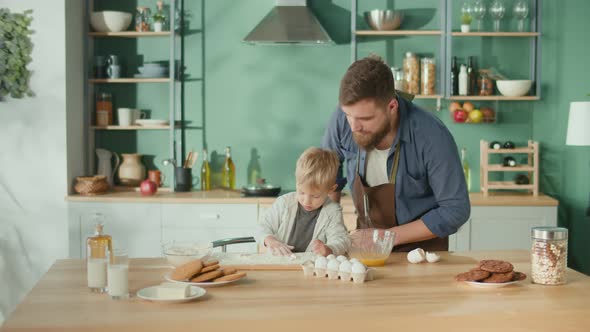 Single Father With Son Cooking Together