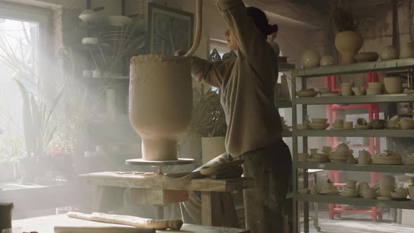 Woman Is Shaping Vase Walls of Raw Clay