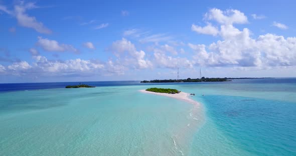 Natural flying abstract view of a white sand paradise beach and aqua turquoise water background 