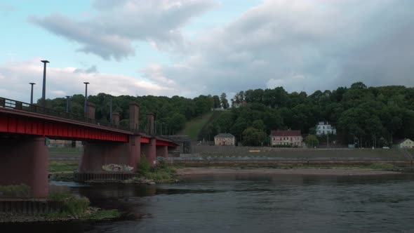 Time lapse of a Soviet heritage bridge over a River Nemunas in Kaunas with a heavy storm cloudsing a