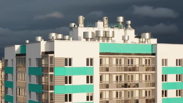 Aerial View of a Residential Building Against the Backdrop of an Urban Landscape