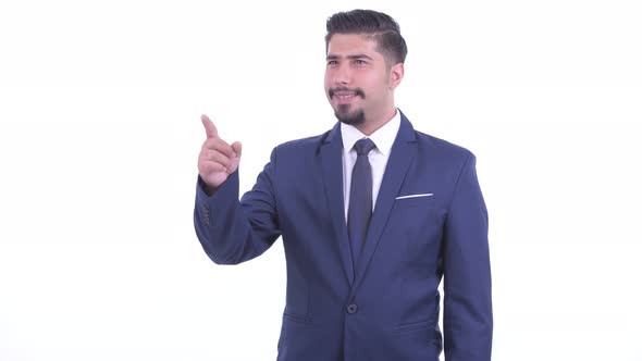 Happy Bearded Persian Businessman Pointing Finger and Directing