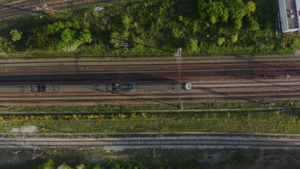 Aerial view. Modern high speed train. Railroad in landscape, aerial view from above. 