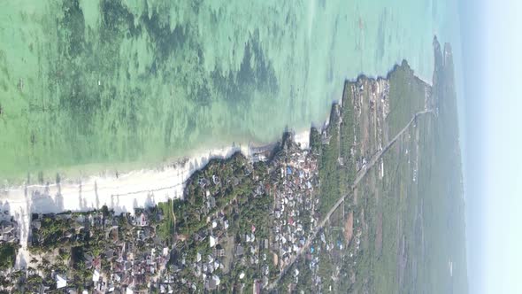 Vertical Video of the Ocean Near the Coast of Zanzibar Tanzania Aerial View