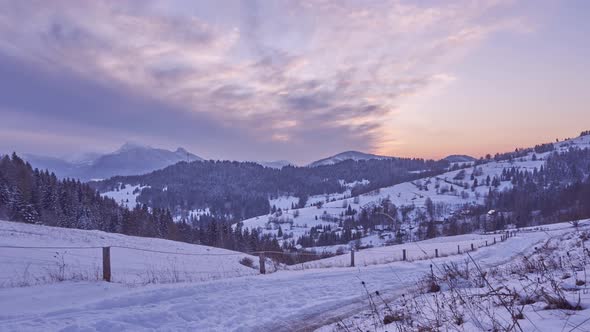 Sunset  winter snow landscape. The sky is colored red