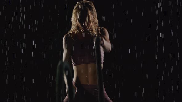 Athletic Blond Woman Working Out In The Rain