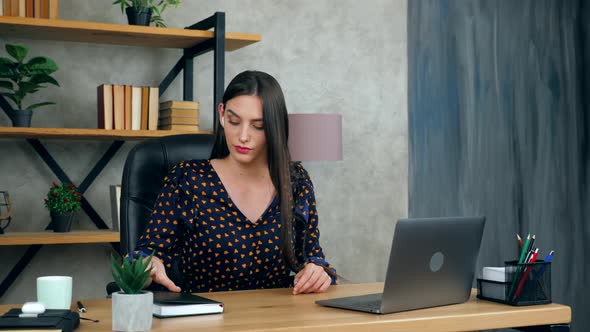 Woman in home office wears wireless earphones study remote online video conference call with tutor