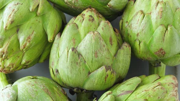 Whole Fresh Artichokes on Plate