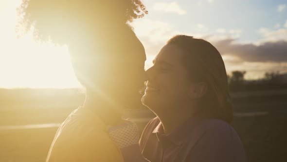 Happy women gay couple having tender moments during sunset outdoor