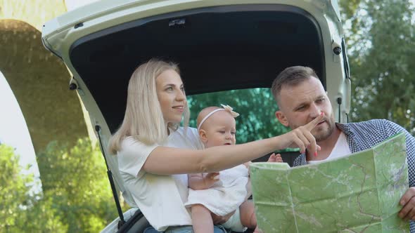 Happy Family Traveling By Car