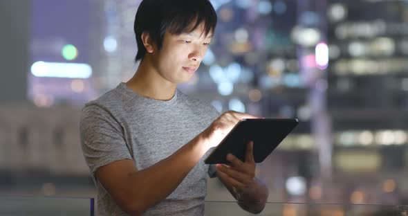 Asian Man Look at Tablet Computer