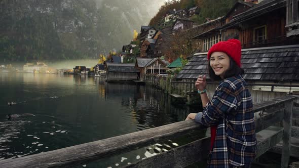 A Young Woman Takes a Selfie By Lake Hallstatt