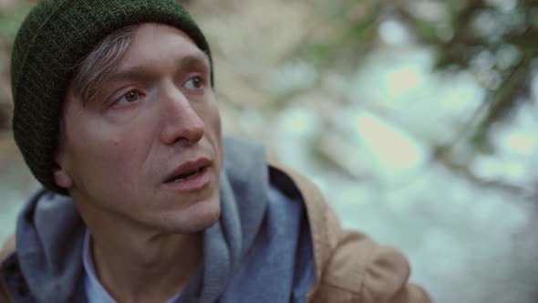 Portrait of a Man Hiker Walking on Trail in Woods