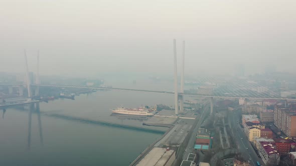 Drone View of the Golden Bridge and the City at Dawn in Heavy Smog