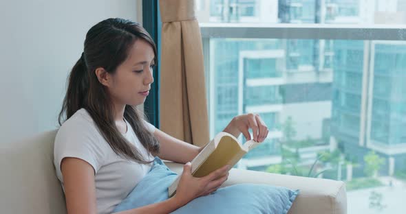 Woman read on book at home