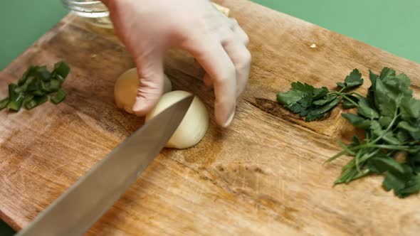 Clove of garlic cut in pieces on a wooden table.