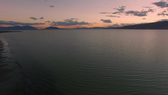 Flying over Utah Lake at dusk as the sky fades color