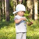 Little girl collect and eat wild blueberries - VideoHive Item for Sale