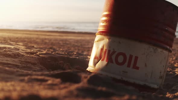 Discarded Oil Can On Beach