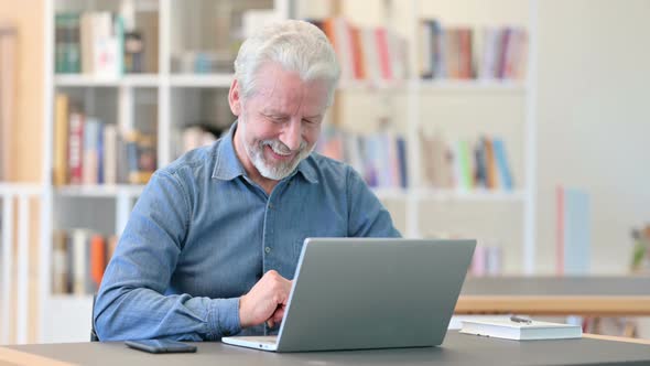 Old Man Doing Video Call on Laptop