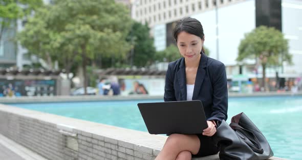 Businesswoman work on laptop computer at outdoor