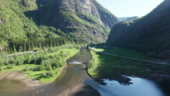 Approaching the river of Dale in beautiful idyllic landscape Dalevagen during sunrise - Forwarding a