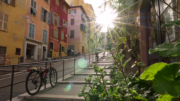 Steadicam Shot of Street in the Old City of Nice, France. The Sun Is Illuminating the Street in the