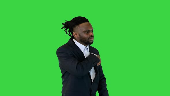 Black Man in Office Suit Walk Counting Money on a Green Screen Chroma Key