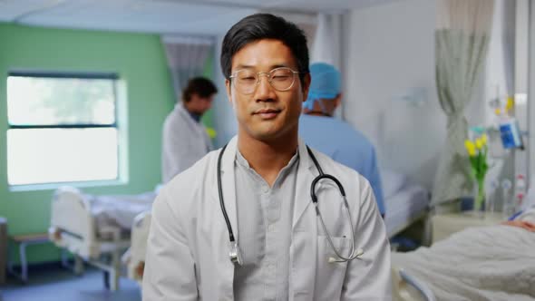 Male doctor standing in the ward at hospital 4k