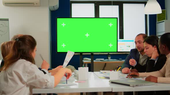 In Corporate Office Meeting Room Stands Green Mockup Screen TV