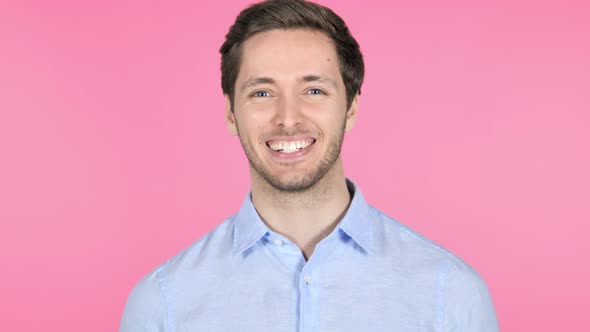 Yes, Admiring Young Man on Pink Background