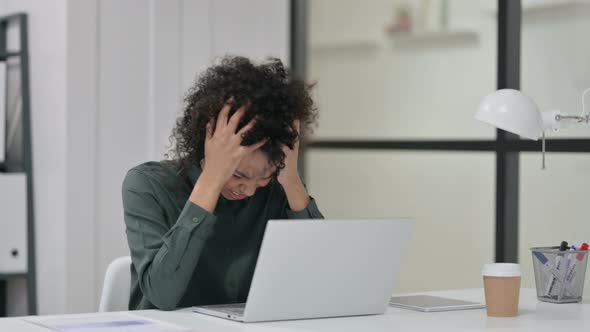 African Woman Feeling Disappointed While Using Laptop