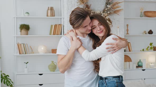 Caucasian Couple Married Man and Woman Guy and Girl Embracing Stand at New Home Together Husband and