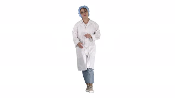 Friendly Female Doctor Walking and Talking To Camera on White Background.