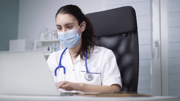 Physician working in clinic during pandemic