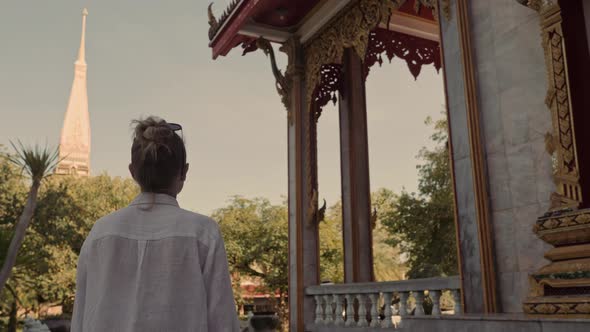 Beautiful Woman Walks Near Buddha Temple in Wat Chalong. Sightseeing