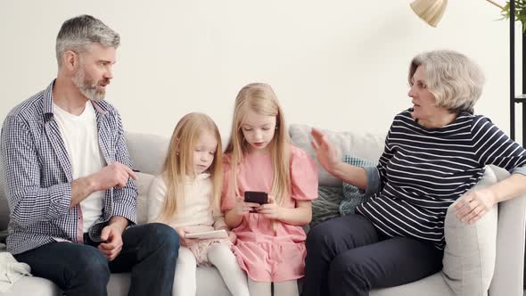 Mature Man and Woman Spending Time with Grandparents