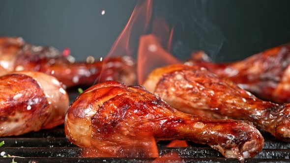 Super Slow Motion Shot of Seasoning Falling on Fresh Grilled Chicken Legs at 1000 Fps