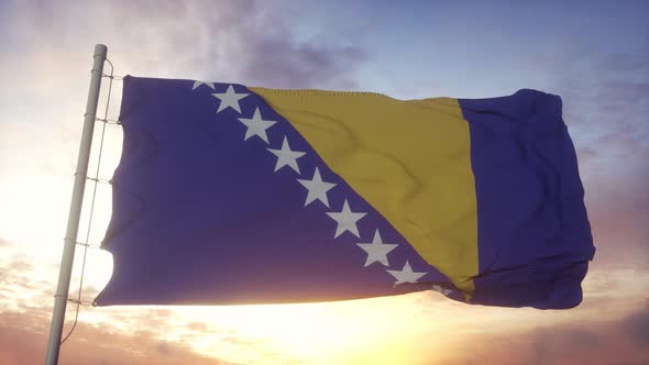 Flag of Bosnia and Herzegovina Waving in the Wind Sky and Sun Background