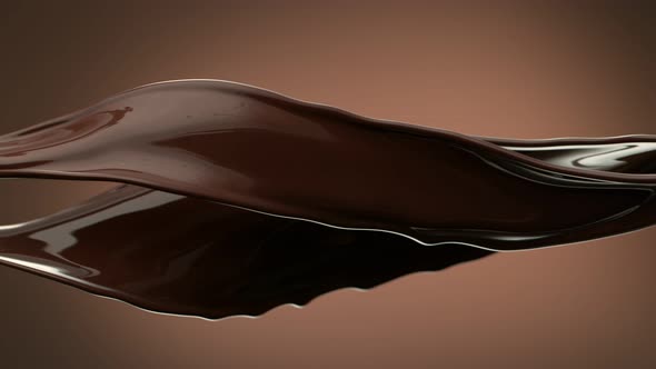 Super Slow Motion Shot of Flying Chocolate Splashes on Brown Gradient Background at 1000 Fps