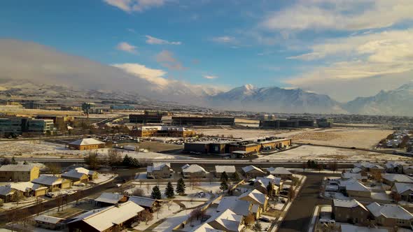Panoramic aerial view of Lehi, Utah with fresh layer of snow and a view of Silicon Slopes