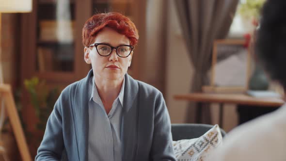 Female Psychologist Consulting Patient on Therapy Session